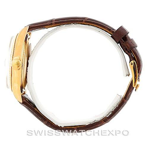 This image shows a side view of a Rolex President 1803 Men
s Yellow Gold Silver Dial 1803 Men
s Yellow Gold Silver Dial model with a leather strap and gold case.