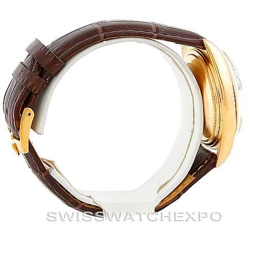 The image shows a side view of the Rolex President 1803 Men
s Yellow Gold Silver Dial 1803 Men
s Yellow Gold Silver Dial model watch featuring its case, crown, and brown leather strap.