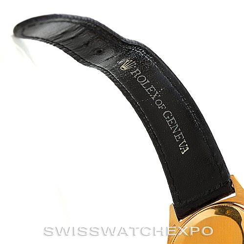 This image shows a close-up of the leather strap and part of the case of a Rolex President 1803 Men
s Yellow Gold Silver Dial 1803 Men
s Yellow Gold Silver Dial model watch.