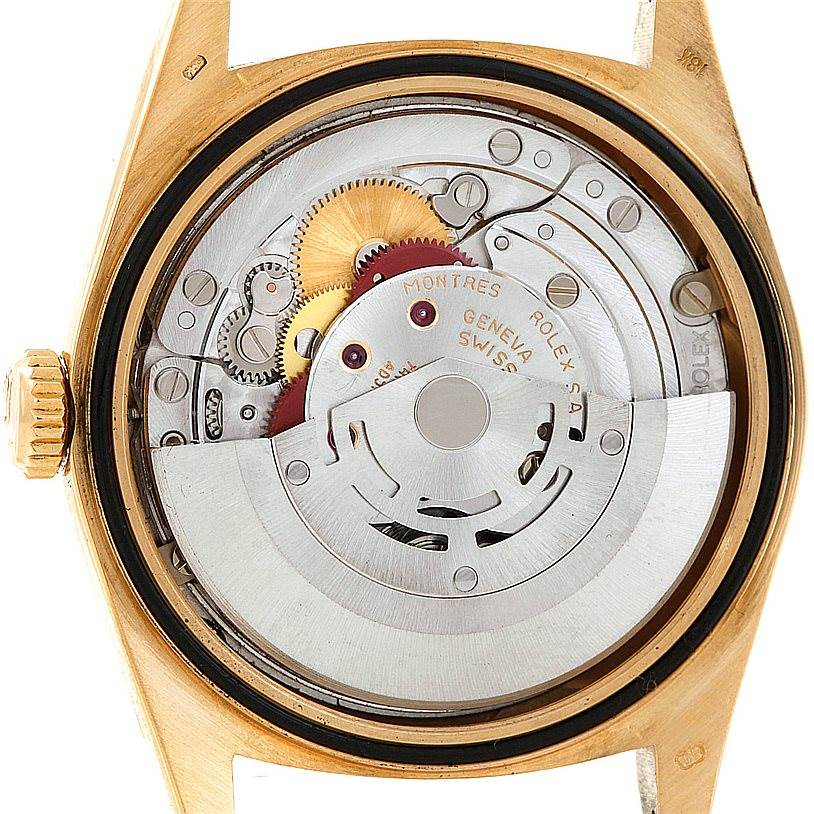 This image shows the back view of a Rolex President 18238 Men
s Yellow Gold Champagne Dial 18238 Men
s Yellow Gold Champagne Dial model watch, featuring its inner mechanical movement and gears.