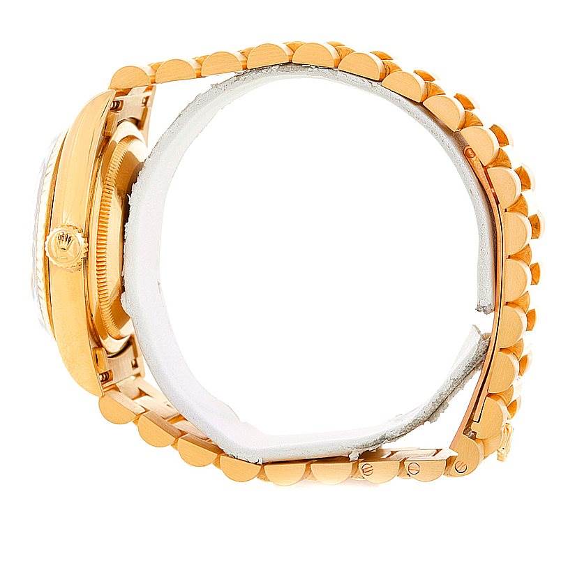 The image shows a side view of a Rolex President 18238 Men
s Yellow Gold Champagne Dial 18238 Men
s Yellow Gold Champagne Dial watch, displaying the crown, bezel, and part of the bracelet.