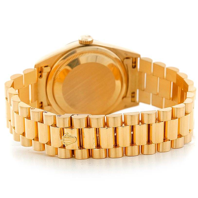 This image shows the Rolex President 18238 Men
s Yellow Gold Champagne Dial 18238 Men
s Yellow Gold Champagne Dial watch from behind, highlighting the gold case and bracelet.