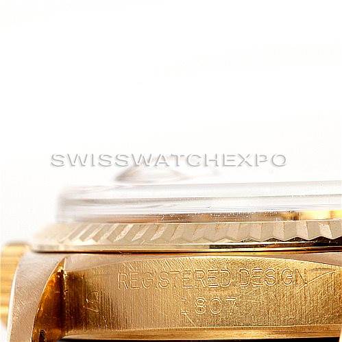 The image shows a close-up side view of the Rolex President 1807 Men
s Yellow Gold Silver Dial 1807 Men
s Yellow Gold Silver Dial model watch, showcasing the registered design etching.