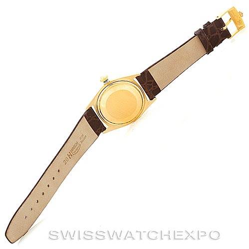The image shows the back view of a Rolex President 1807 Men
s Yellow Gold Silver Dial 1807 Men
s Yellow Gold Silver Dial model watch, highlighting its case and leather strap.