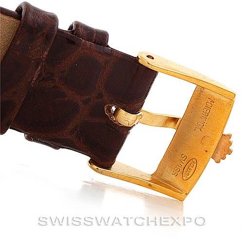 This image shows a side view of a Rolex President 1807 Men
s Yellow Gold Silver Dial 1807 Men
s Yellow Gold Silver Dial model watch buckle with brown leather straps.