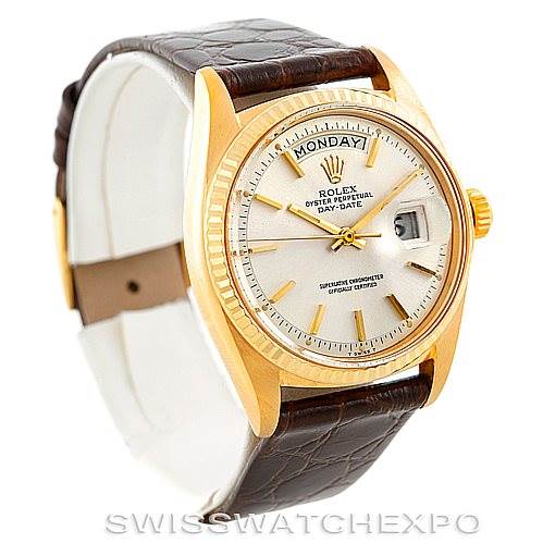 This image shows a Rolex President 1807 Men
s Yellow Gold Silver Dial 1807 Men
s Yellow Gold Silver Dial model watch at a three-quarter angle, highlighting its dial, bezel, crown, and leather strap.