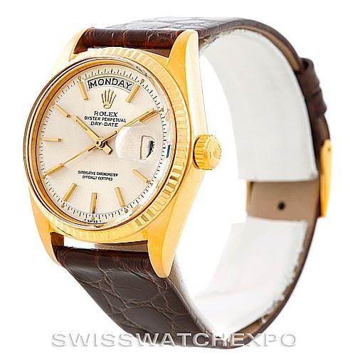 The image shows a Rolex President 1807 Men
s Yellow Gold Silver Dial 1807 Men
s Yellow Gold Silver Dial model watch at a front side angle, featuring its dial, bezel, and leather strap.