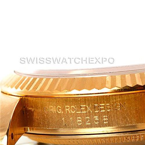 This close-up image shows the case side and the bezel of the Rolex President 118238 Men's Yellow Gold Champagne Dial 118238 Men's Yellow Gold Champagne Dial model, highlighting the engraved model information.