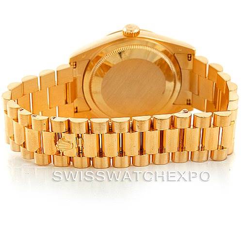 The image shows the back and bracelet of a Rolex President 118238 Men's Yellow Gold Champagne Dial 118238 Men's Yellow Gold Champagne Dial model watch, highlighting its gold finish and clasp.