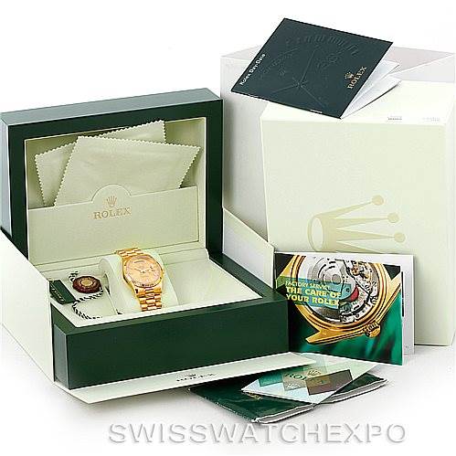 This image shows a Rolex President 118238 Men's Yellow Gold Champagne Dial 118238 Men's Yellow Gold Champagne Dial watch in its box with accessories, manuals, warranty card, and cleaning cloths.