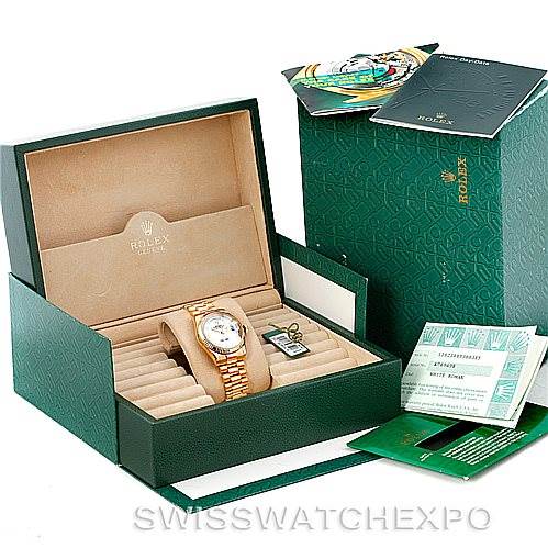 The image shows a Rolex President 118238 Men's Yellow Gold White Dial 118238 Men's Yellow Gold White Dial watch and its accessories, including its box, manuals, and tags.