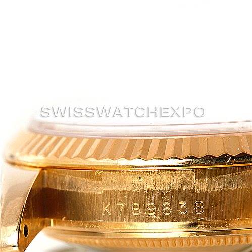 This image shows a close-up, side angle view of the serial number on the case of a Rolex President 118238 Men's Yellow Gold White Dial 118238 Men's Yellow Gold White Dial model watch.