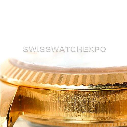 This image shows a close-up of the side profile of the Rolex President 118238 Men's Yellow Gold White Dial 118238 Men's Yellow Gold White Dial model's gold case and engraved bezel.