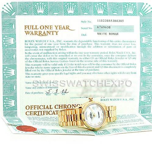 The image shows a Rolex President 118238 Men's Yellow Gold White Dial 118238 Men's Yellow Gold White Dial model watch with a white Roman dial, placed on top of its warranty and certification papers.