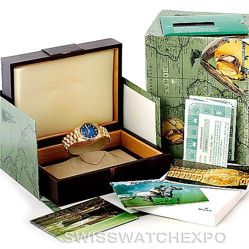 The image shows a Rolex President 18238 Men's Yellow Gold Blue Dial 18238 Men's Yellow Gold Blue Dial model watch in its open box, with the outer packaging, manual, and warranty cards.