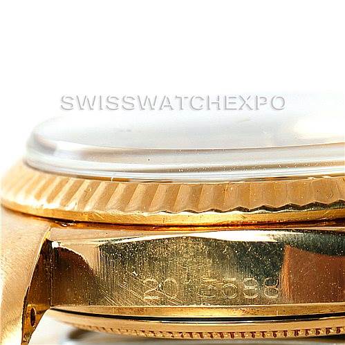 Close-up side view of the Rolex President 1803 Men
s Yellow Gold Champagne Dial 1803 Men
s Yellow Gold Champagne Dial model showing the bezel, crystal, and part of the case with serial numbers.