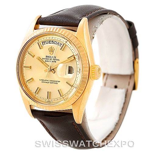 This image shows a President model Rolex watch at an angled view focusing on the dial, bezel, crown, and the leather strap.