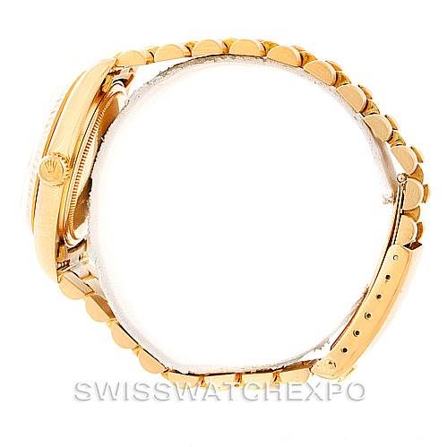 This side view image of a Rolex President 1803 Men
s Yellow Gold Champagne Dial 1803 Men
s Yellow Gold Champagne Dial model watch shows the crown, case, and bracelet.