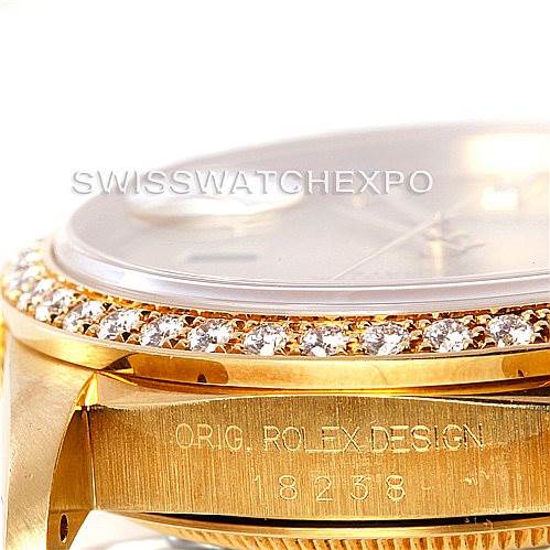 This image shows a close-up angle of the Rolex President 18238 Men
s Yellow Gold Champagne Dial 18238 Men
s Yellow Gold Champagne Dial model watch, focusing on the bezel and part of the case with the engraving "ORIG ROLEX DESIGN 18238".