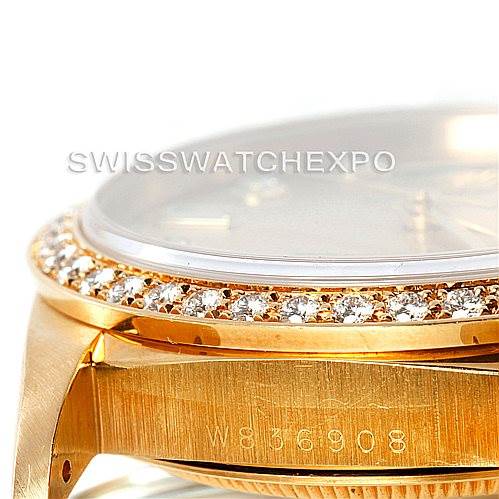This image shows a side view of the bezel and part of the case of a Rolex President 18238 Men
s Yellow Gold Champagne Dial 18238 Men
s Yellow Gold Champagne Dial model watch, highlighting its diamond-set bezel.