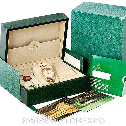 This image shows a Rolex President 18238 Men
s Yellow Gold Champagne Dial 18238 Men
s Yellow Gold Champagne Dial model watch from an angled view, presented in its original box with various accessories and documents.