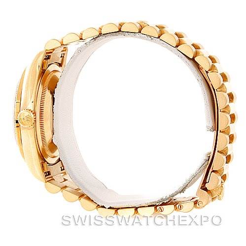 This image shows a side view of a Rolex President 18238 Men
s Yellow Gold Champagne Dial 18238 Men
s Yellow Gold Champagne Dial model watch, highlighting the gold bracelet and crown.