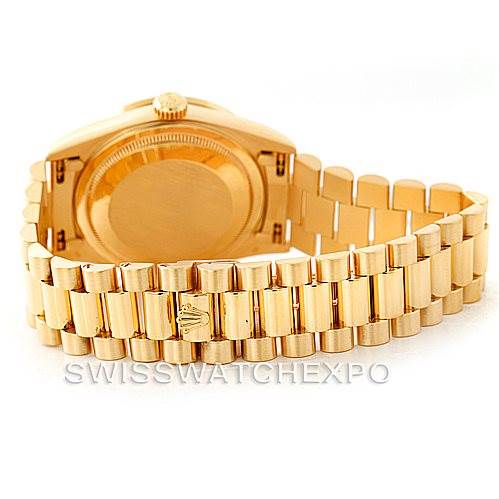 The image shows the back and bracelet of a Rolex President 18238 Men
s Yellow Gold Champagne Dial 18238 Men
s Yellow Gold Champagne Dial model watch from an angle that highlights the case back and clasp.