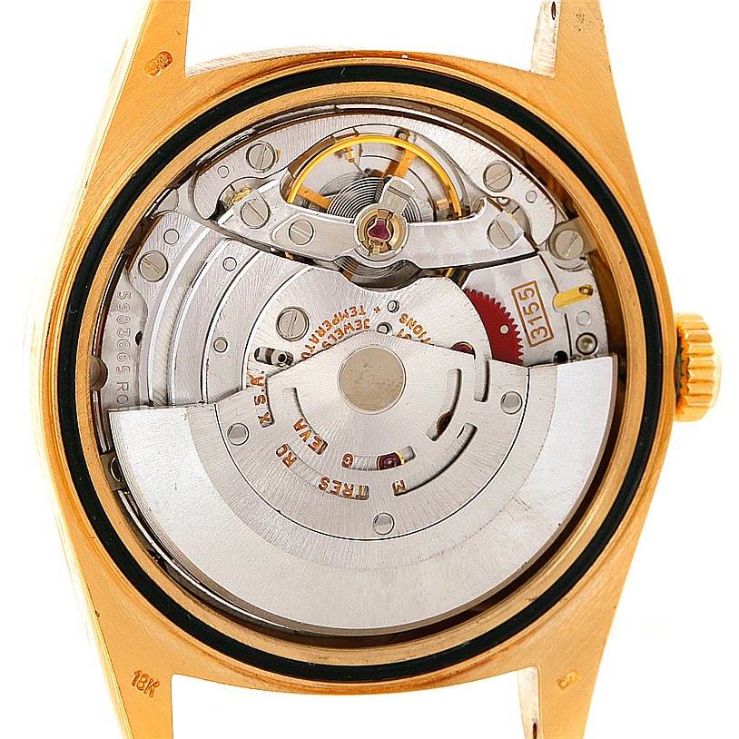 This image shows the back view of the internal mechanism of a Rolex President 18238 Men
s Yellow Gold Champagne Dial 18238 Men
s Yellow Gold Champagne Dial model watch, highlighting its automatic movement parts.