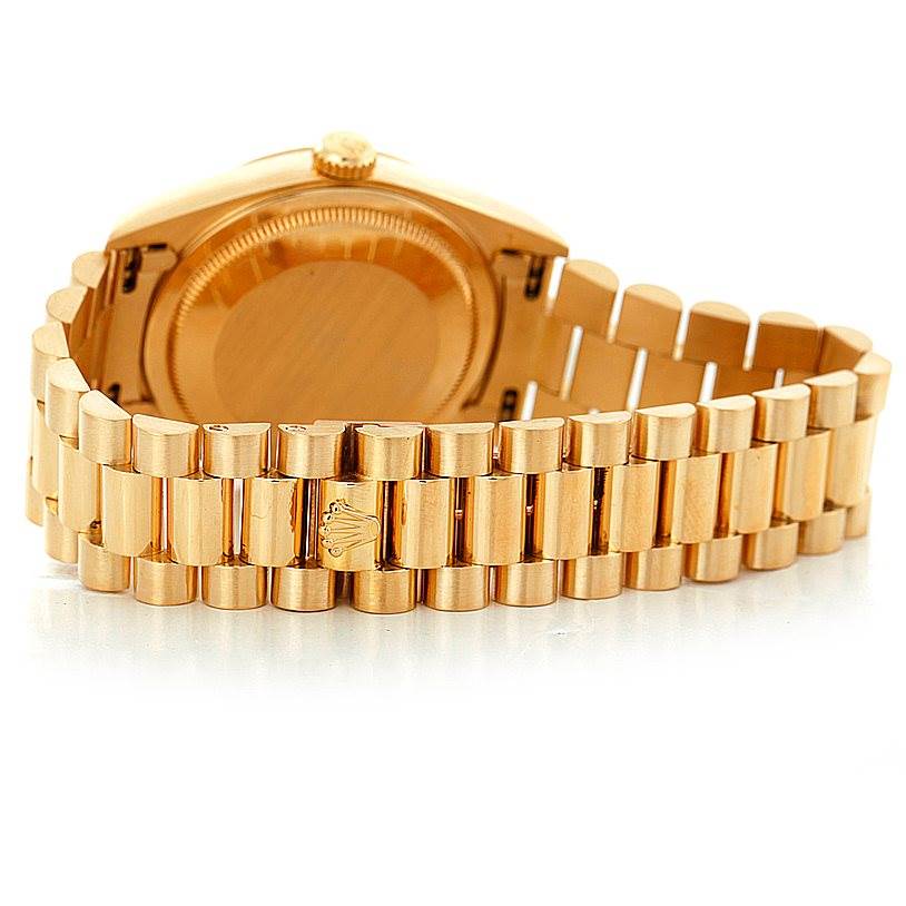 This image shows the back side and bracelet of a Rolex President 18238 Men
s Yellow Gold Champagne Dial 18238 Men
s Yellow Gold Champagne Dial model watch in gold.