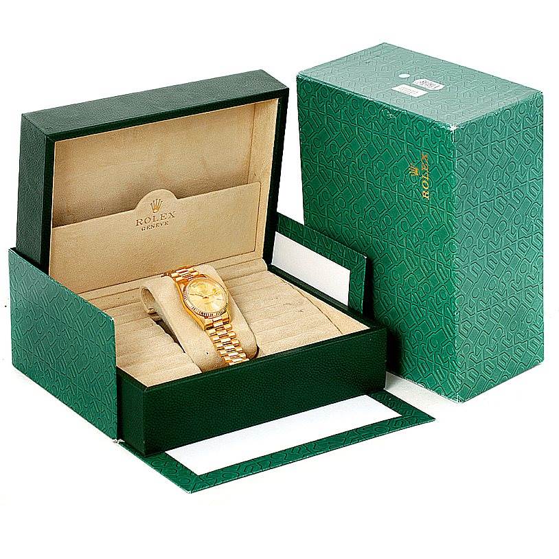 This image shows a Rolex President 18238 Men
s Yellow Gold Champagne Dial 18238 Men
s Yellow Gold Champagne Dial model watch in its open green box, with the outer green packaging box.