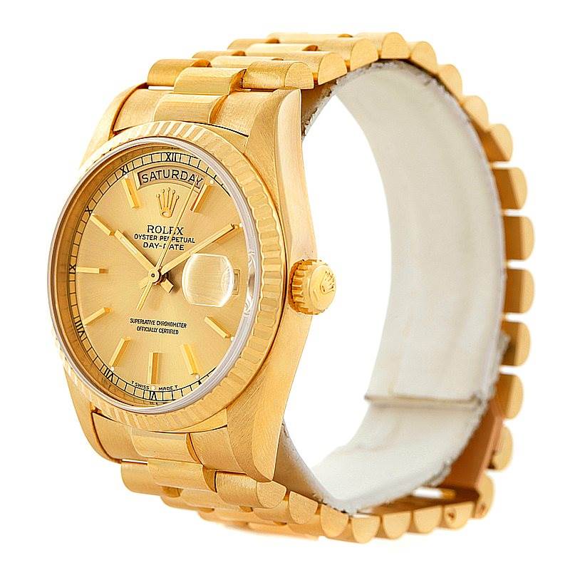 The image shows a Rolex President 18238 Men
s Yellow Gold Champagne Dial 18238 Men
s Yellow Gold Champagne Dial model watch, showcasing the watch face, band, and crown from an angle slightly above and to the side.