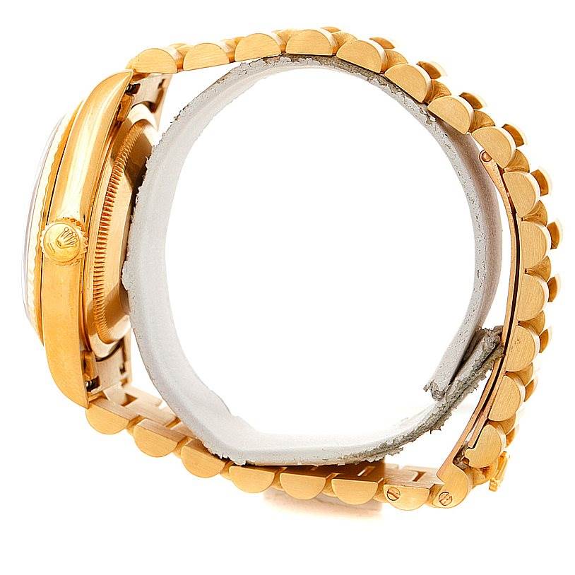 This image shows a side view of a Rolex President 18238 Men
s Yellow Gold Champagne Dial 18238 Men
s Yellow Gold Champagne Dial model watch, highlighting its gold case and linked bracelet.