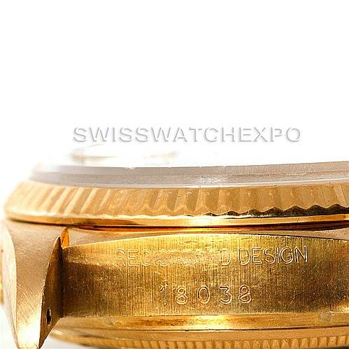 The image shows a close-up side angle of a gold Rolex President 18038 Men
s Yellow Gold Champagne Dial 18038 Men
s Yellow Gold Champagne Dial model, highlighting the engraved bezel and model number.