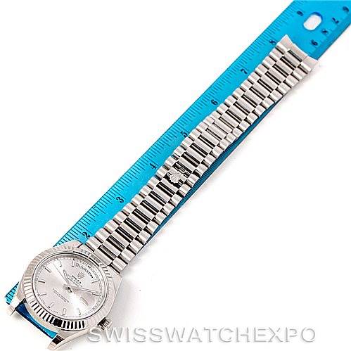 The Rolex President 218239 Men's White Gold Silver Dial 218239 Men's White Gold Silver Dial model watch is shown vertically, with its face, bracelet, and part of a ruler for scale.