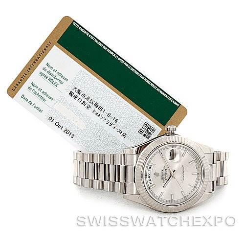 The image shows a Rolex President 218239 Men's White Gold Silver Dial 218239 Men's White Gold Silver Dial model watch angled slightly to the right, with an accompanying certificate in the background.