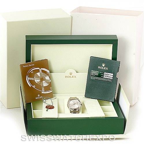 The image shows a Rolex President 218239 Men's White Gold Silver Dial 218239 Men's White Gold Silver Dial model watch inside its green box, along with booklets, tags, and additional packaging.