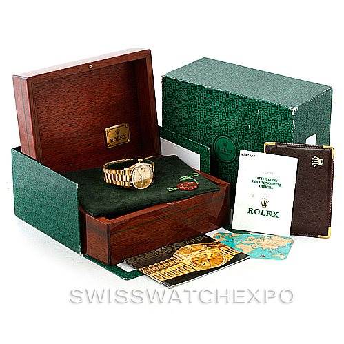 The image shows a Rolex President 18238 Men
s Yellow Gold Champagne Dial 18238 Men
s Yellow Gold Champagne Dial model watch in its box with accompanying booklets and warranty card, viewed from the front angle.