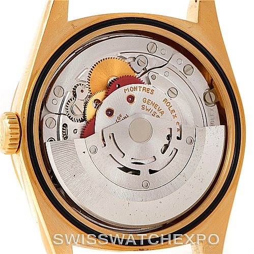 The image shows the inner mechanics of a Rolex President 18238 Men
s Yellow Gold Champagne Dial 18238 Men
s Yellow Gold Champagne Dial model watch from the back with its movement exposed.