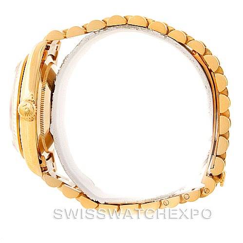 This image shows a side view of the Rolex President 18238 Men
s Yellow Gold Champagne Dial 18238 Men
s Yellow Gold Champagne Dial model watch, highlighting its crown and part of the bracelet.