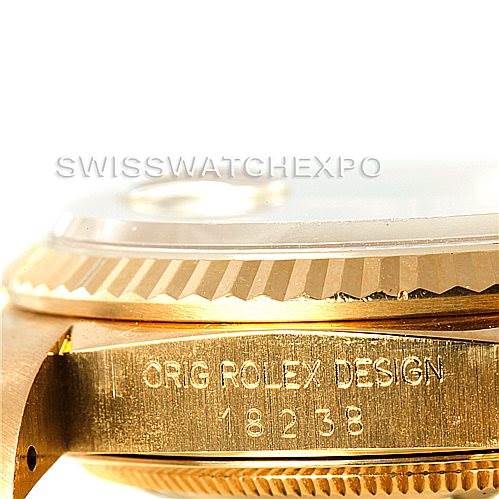 The image shows a close-up side view of a Rolex President 18238 Men
s Yellow Gold Champagne Dial 18238 Men
s Yellow Gold Champagne Dial model watch, highlighting its fluted bezel and engraved case.