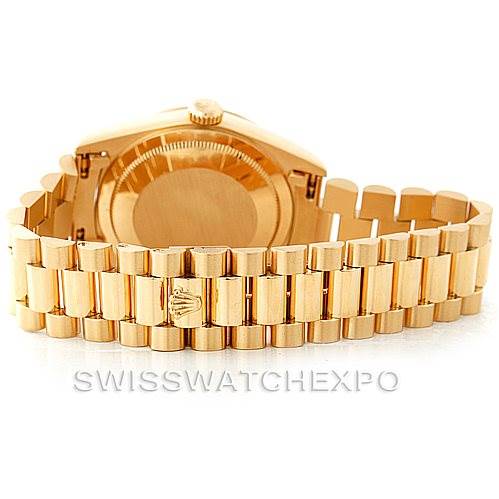 The Rolex President 18238 Men
s Yellow Gold Champagne Dial 18238 Men
s Yellow Gold Champagne Dial model watch is shown from the back, highlighting the case back and the linked bracelet.