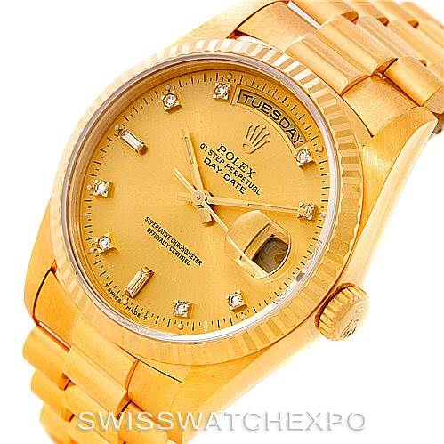 The image shows a President model Rolex watch from an angled top view, highlighting the dial, bracelet, and date display.