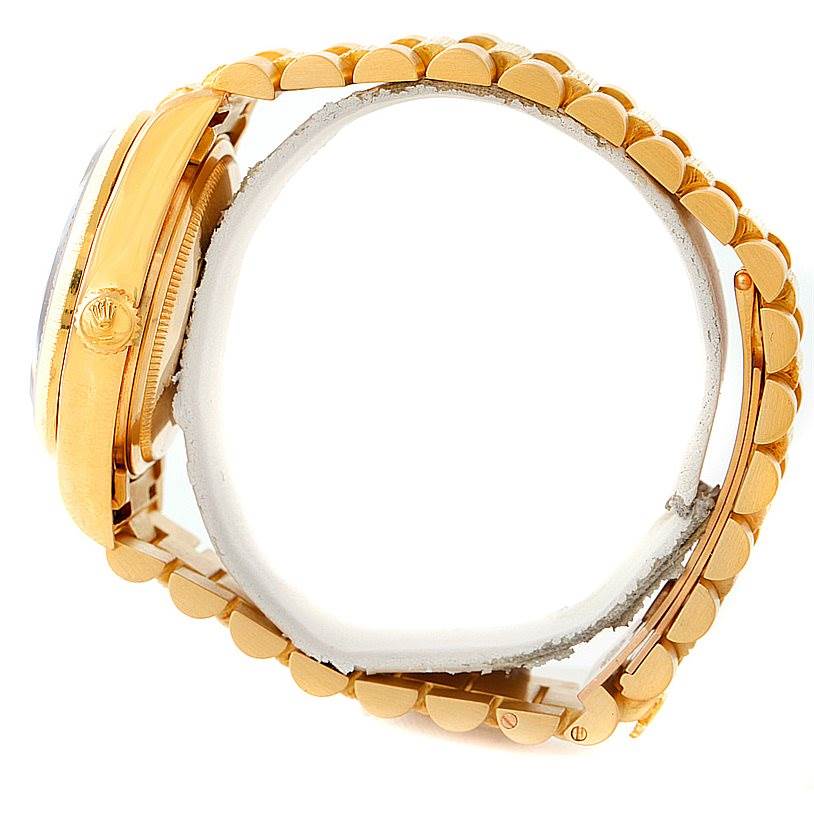 The image shows a side view of a Rolex President 18038 Men
s Yellow Gold Brown Dial 18038 Men
s Yellow Gold Brown Dial watch model, highlighting its gold case and bracelet.