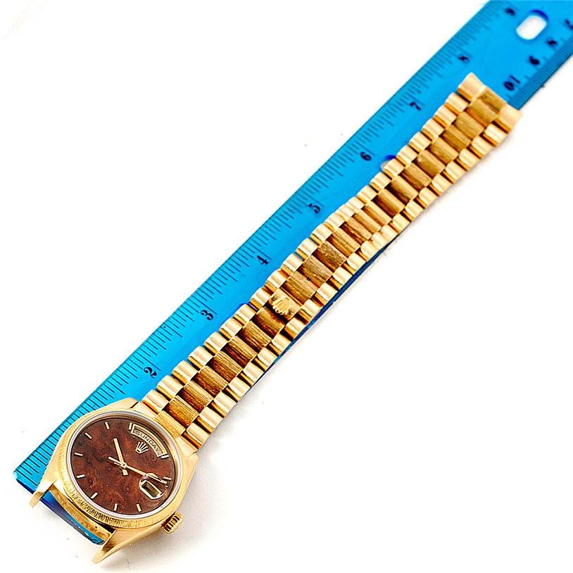 The Rolex President 18038 Men
s Yellow Gold Brown Dial 18038 Men
s Yellow Gold Brown Dial model watch is shown from an overhead angle, displaying the face, crown, and full bracelet.