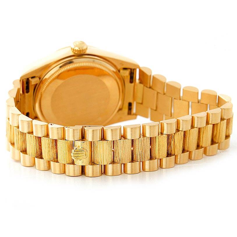 The image shows the back and bracelet of a Rolex President 18038 Men
s Yellow Gold Brown Dial 18038 Men
s Yellow Gold Brown Dial model watch.