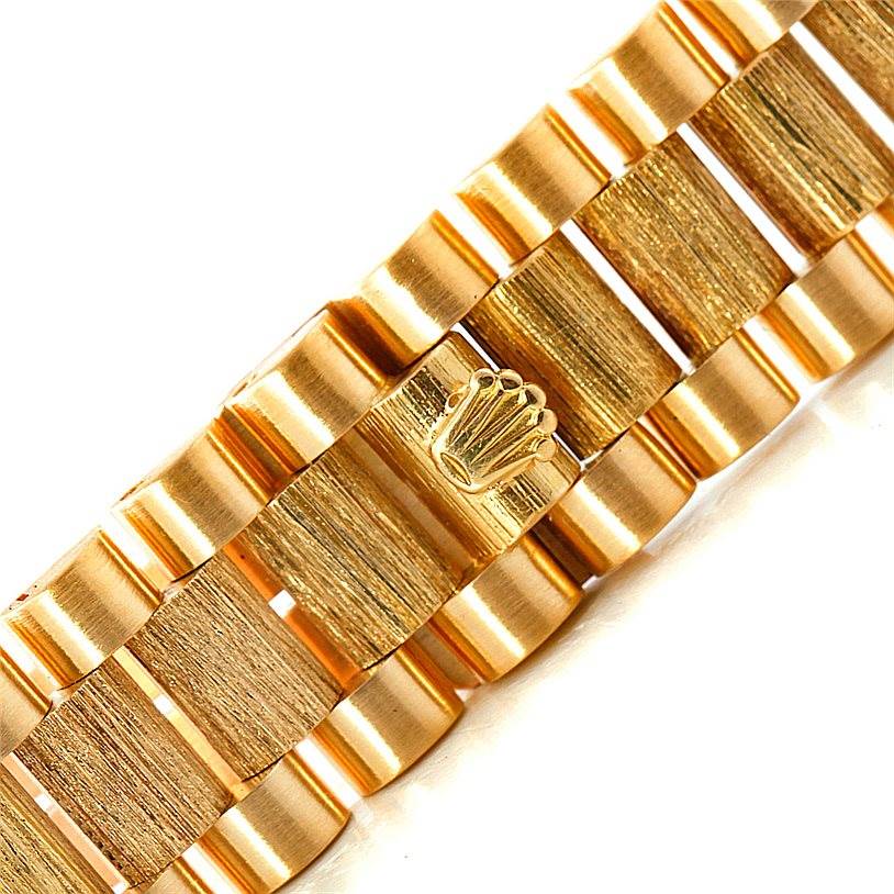 This image shows a close-up of the bracelet and clasp of a President model by Rolex.