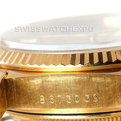 The image shows a close-up side view of the gold case, fluted bezel, and part of the serial number on a Rolex President 18038 Men
s Yellow Gold Champagne Dial 18038 Men
s Yellow Gold Champagne Dial model.