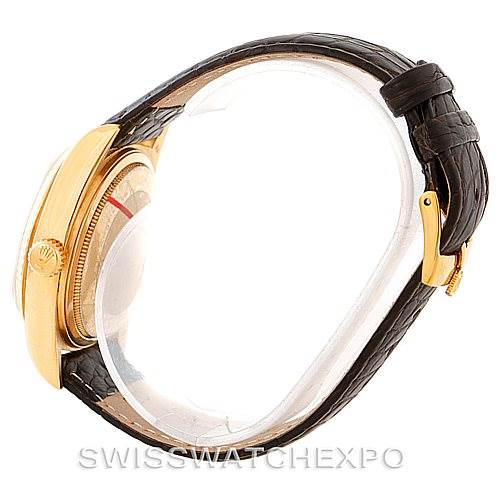 This image shows the side view of a Rolex President 18038 Men
s Yellow Gold Champagne Dial 18038 Men
s Yellow Gold Champagne Dial model, highlighting its gold case and black leather strap.