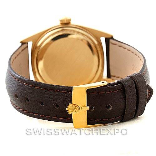 The image shows the back case and leather strap of the Rolex President 1803 Men
s Yellow Gold Champagne Dial 1803 Men
s Yellow Gold Champagne Dial model watch, viewed from the rear.
