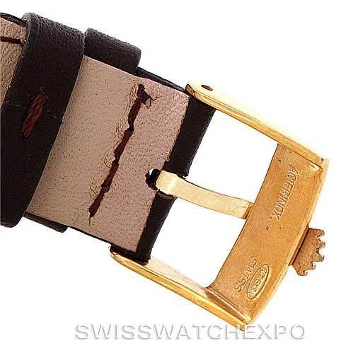 This image shows the gold buckle and part of the leather strap of a Rolex President 1803 Men
s Yellow Gold Champagne Dial 1803 Men
s Yellow Gold Champagne Dial model watch.